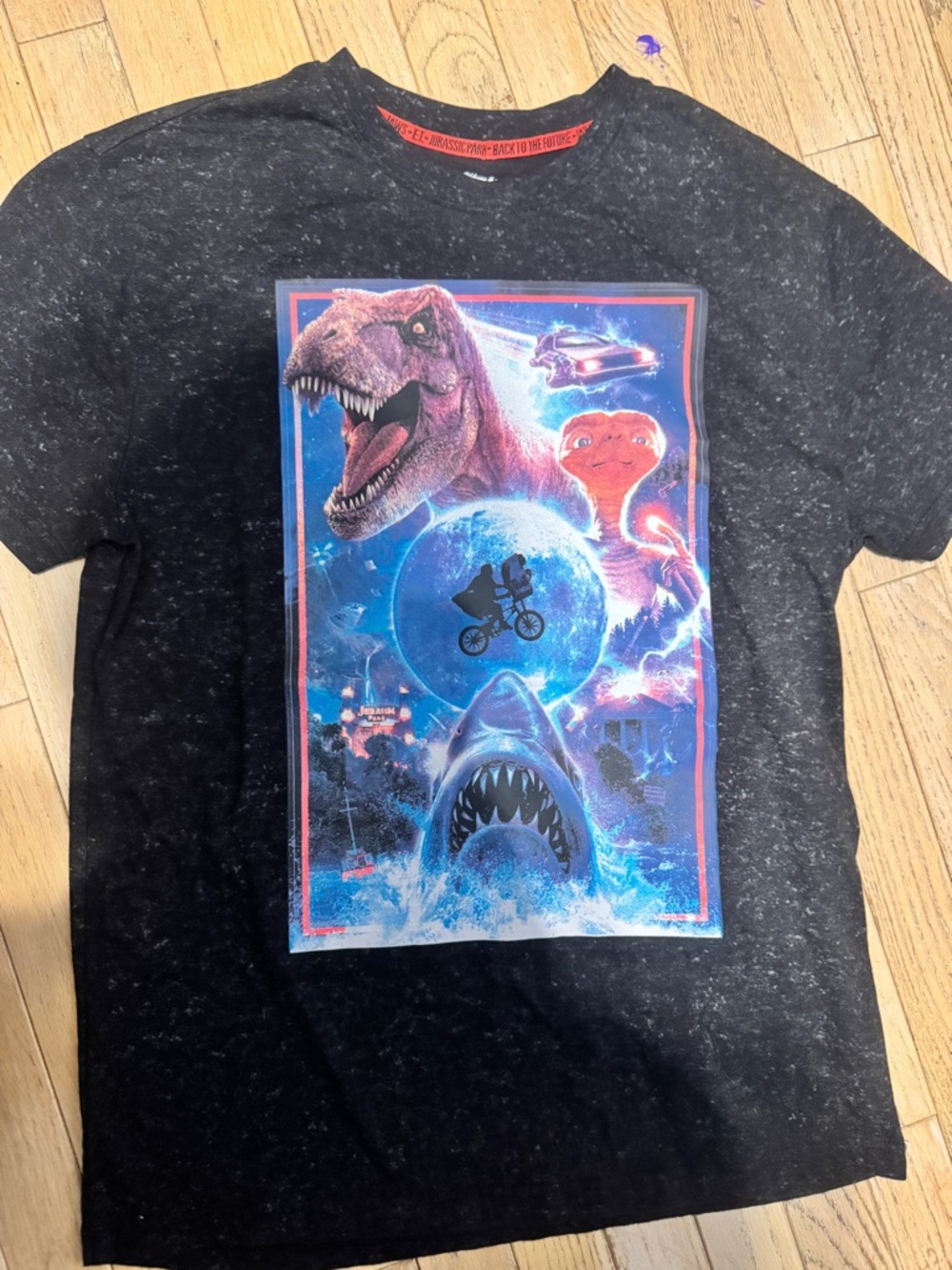 Universal Black Marble Tee with Neon Retro Sci‑Fi Collage